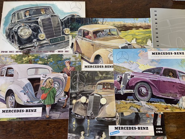 a lot of antique mercedes benz catalogues