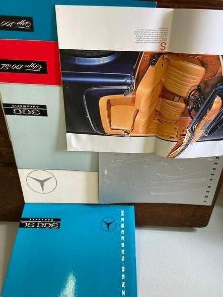 a lot of antique mercedes benz catalogues