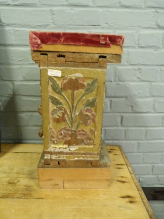 A wooden carved stand