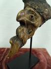 A wooden pipe head